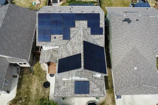 Aerial view of a solar panel array spanning the roof of a Red Deer home